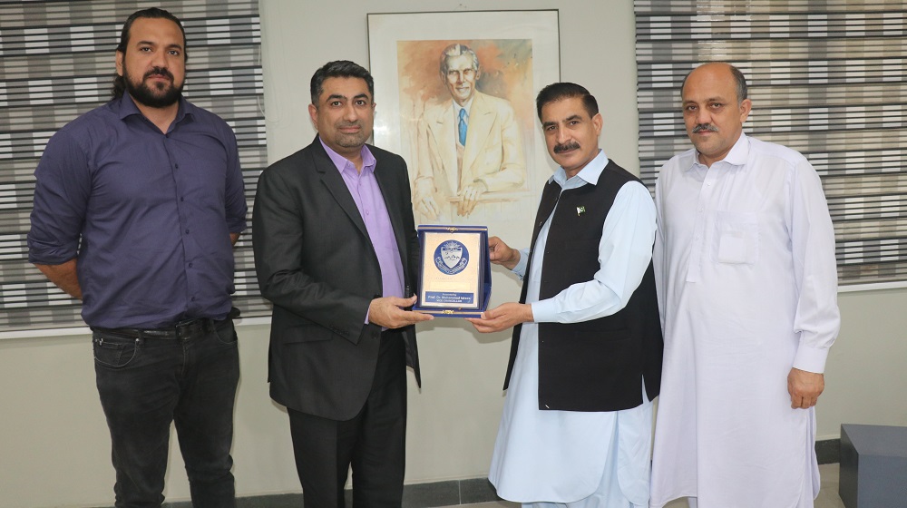 Vice Chancellor University of Peshawar Prof. Dr. Muhammad Idrees (R) presents a souvenir to the registrar Institute of Business Administration (IBA), Karachi Dr Mohammed Asad Ilyas (L) upon his visit to the University of Peshawar.